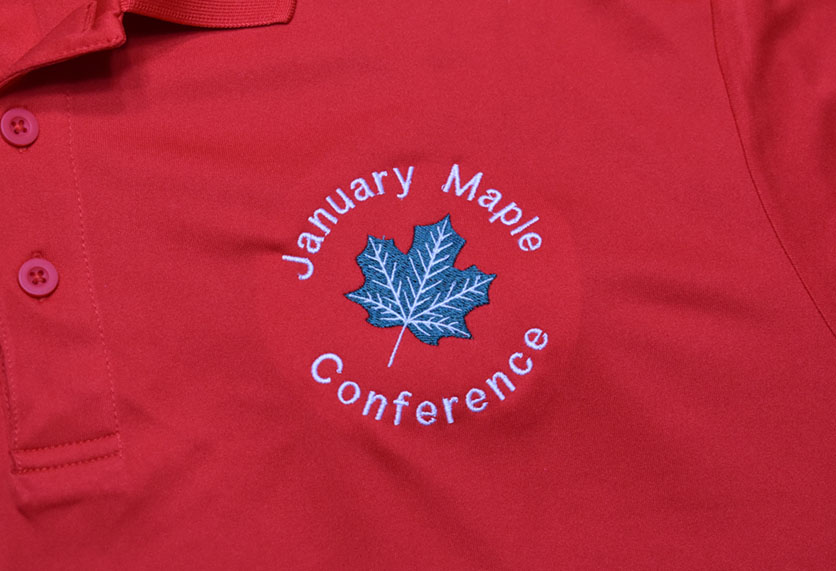 january maple conference red polo closeup